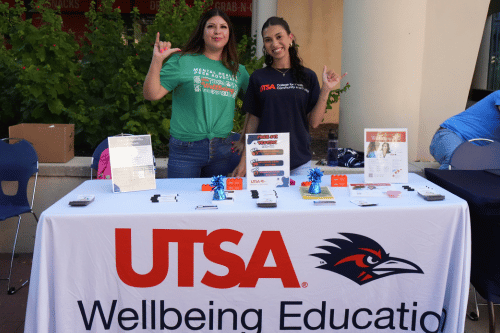 two people tabling for Wellbeing Education