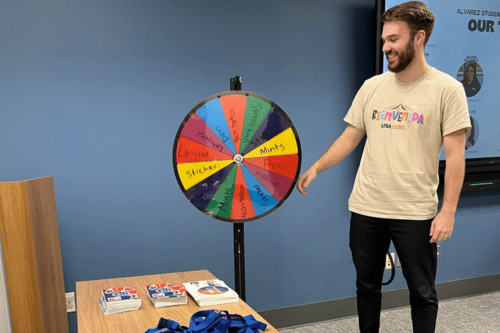 student spinning a prize wheel
