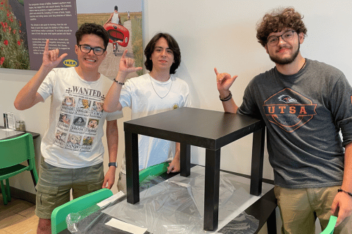 3 students building a black end table