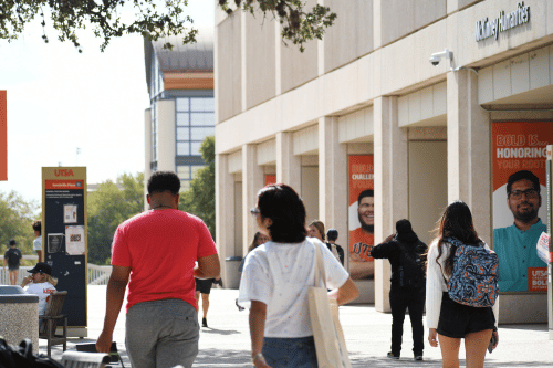 students walking in front of McKinney Humanity Building