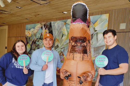 three students and Democracy Dino