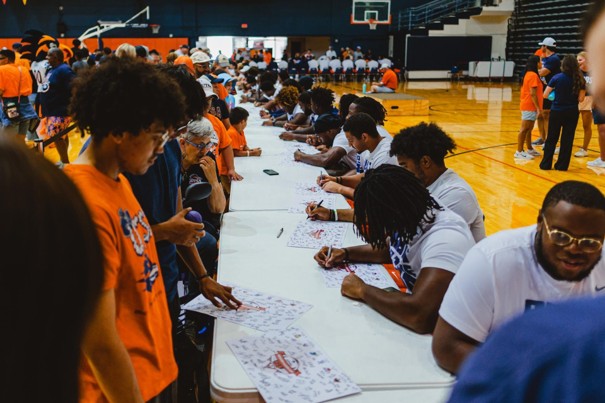 UTSA athletes signing autographs at Fan Fest