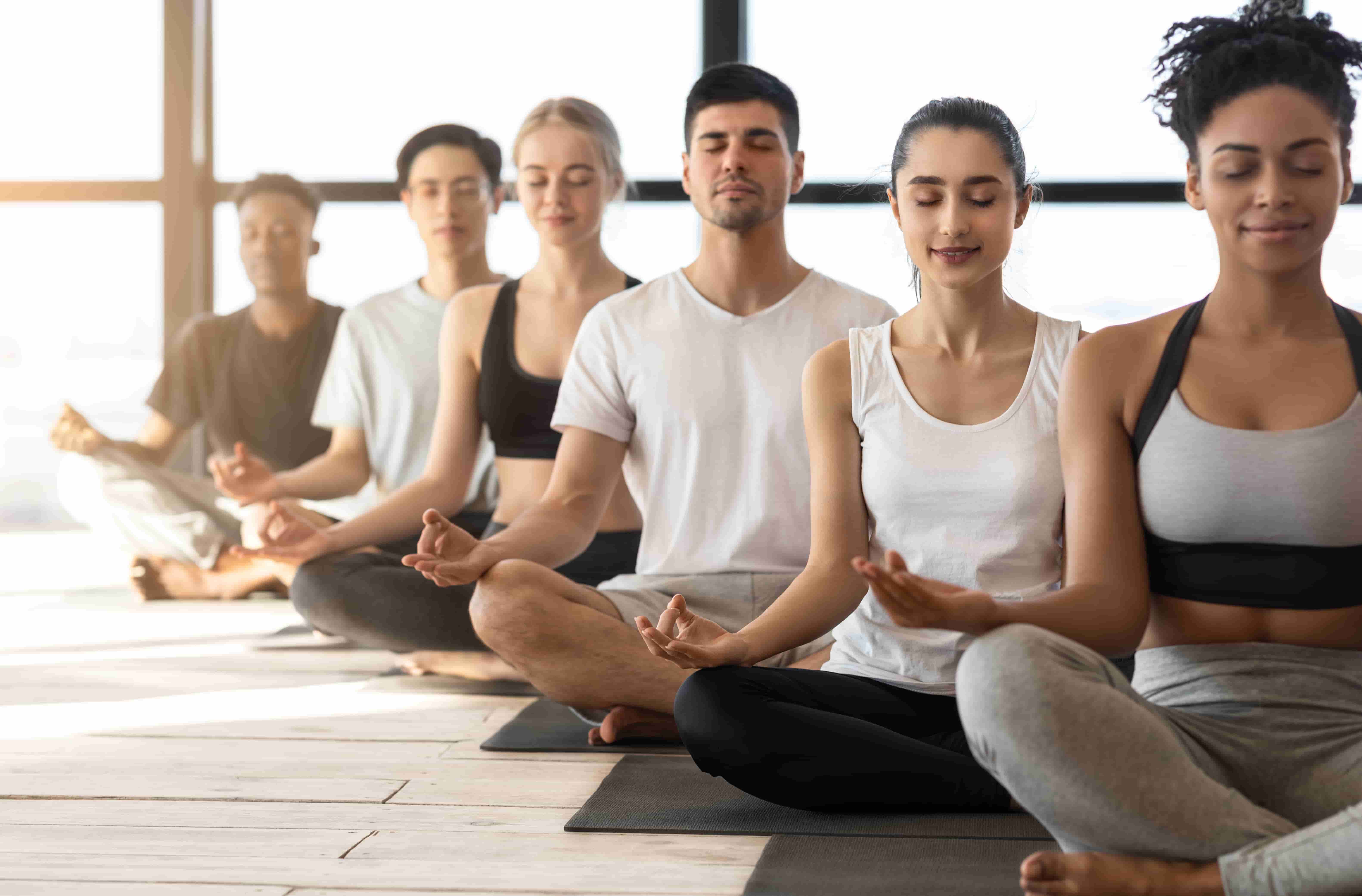 six students meditating