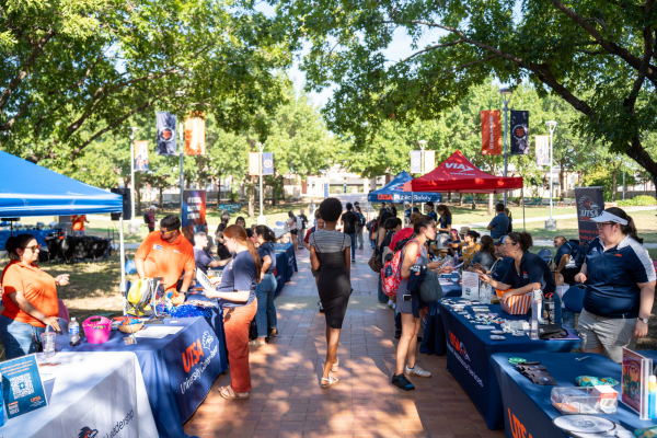 students browsing tables in Bill Miller Plaza