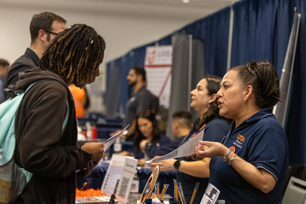 a student gets information from a business recruiter