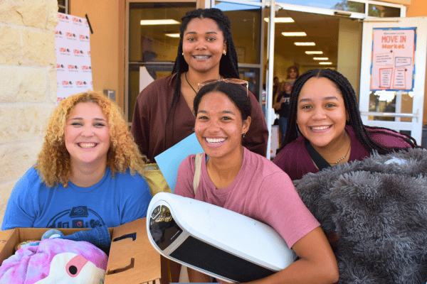 four students leaving Move In Market