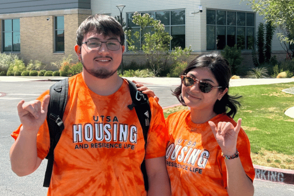 two resident assistant in orange tie dye shirts