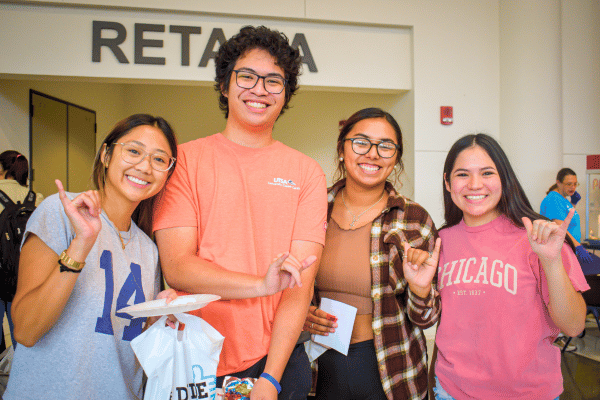 four students at the Pre-Game event