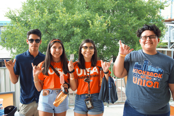 Student with the Birds Up hand gesture