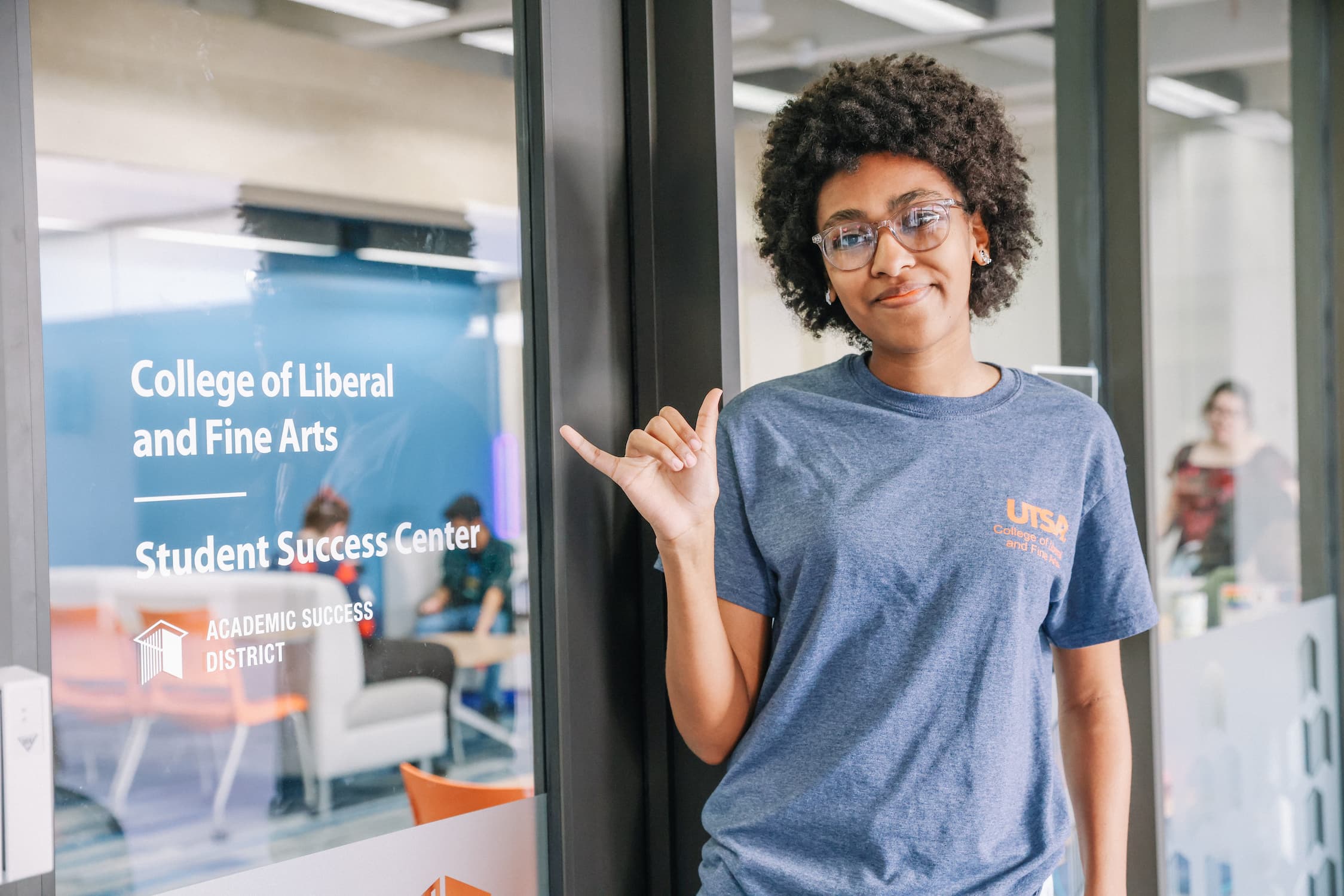 Student in front of COLFA office